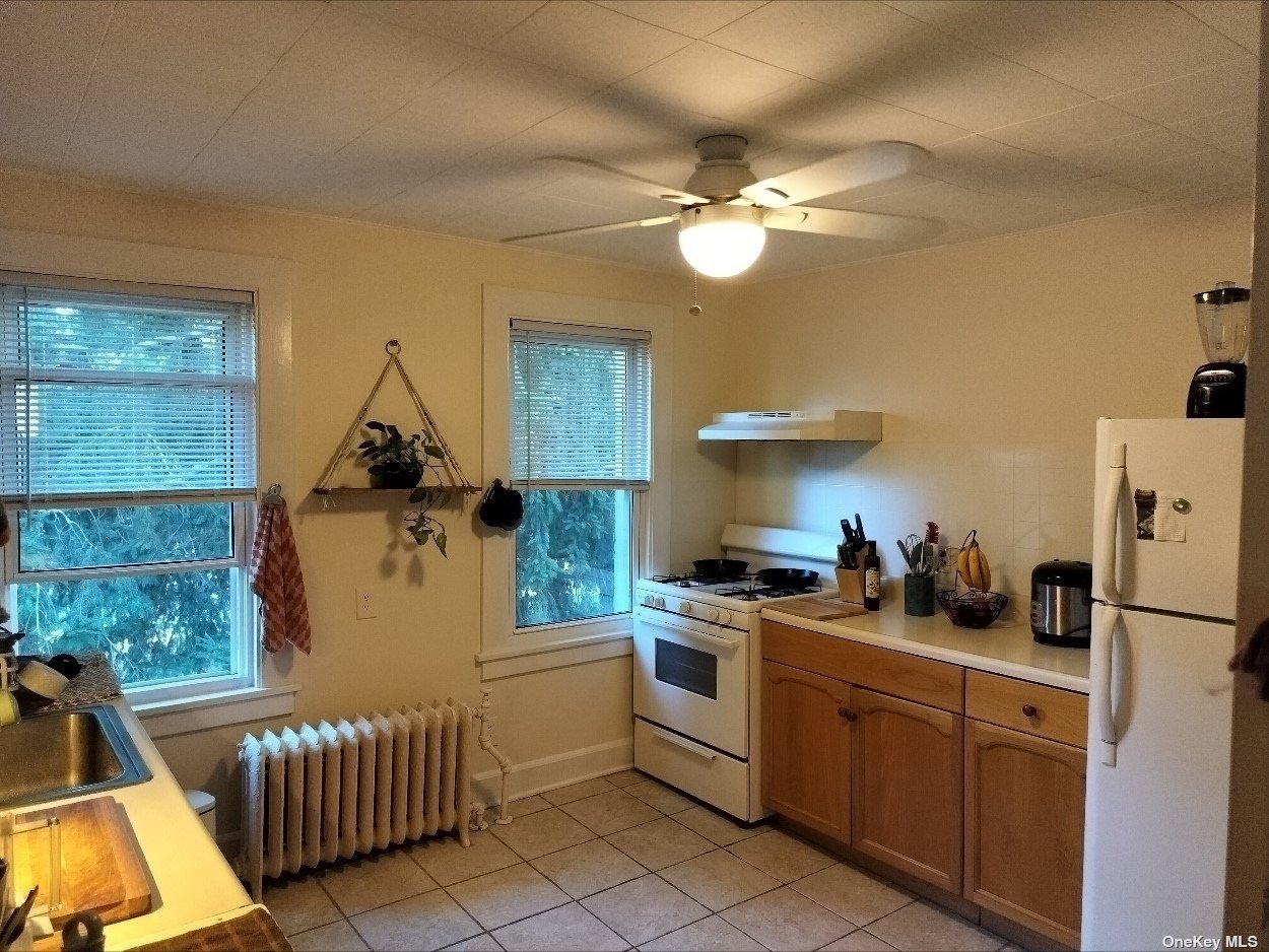 a kitchen that has a sink and a stove