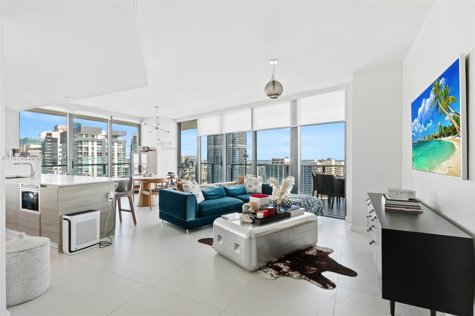 a room with furniture and a floor to ceiling window