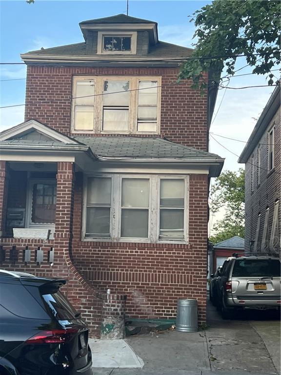 a front view of a house with parking