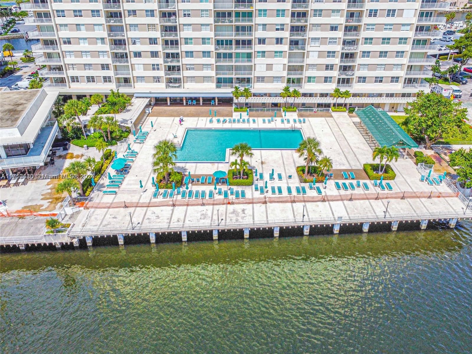 a view of a swimming pool with a patio