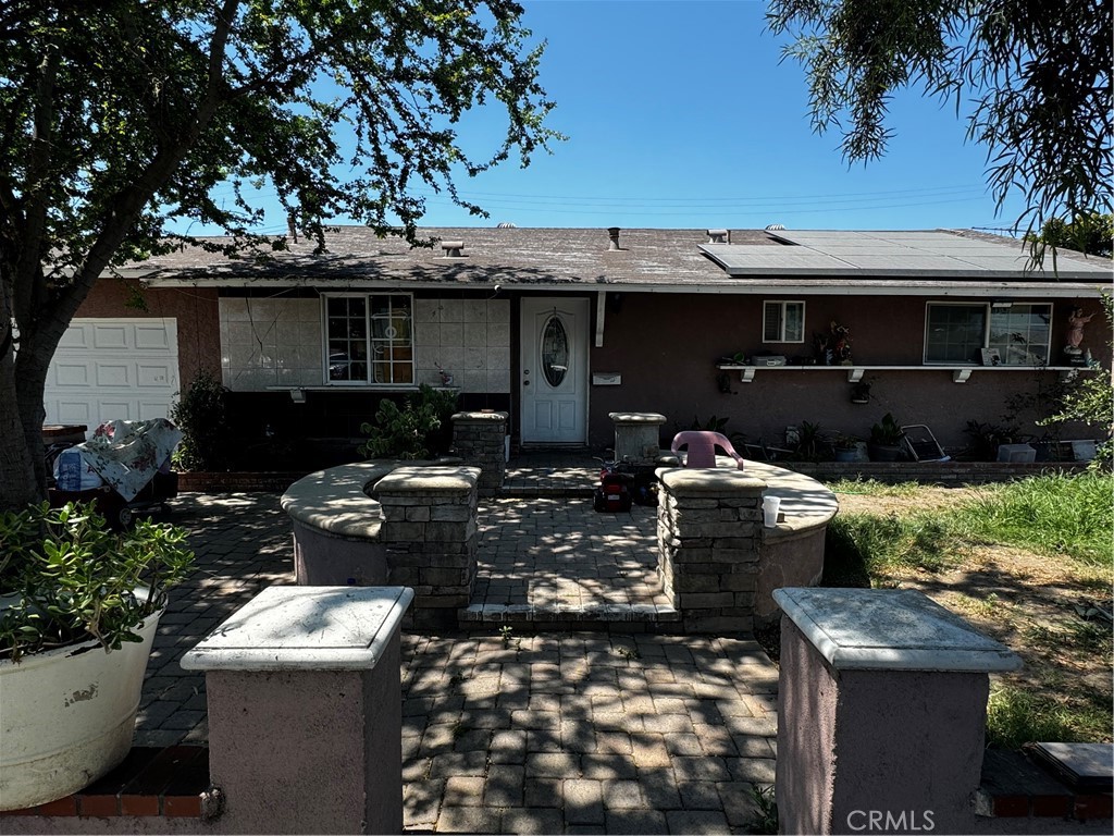 a front view of a house with yard