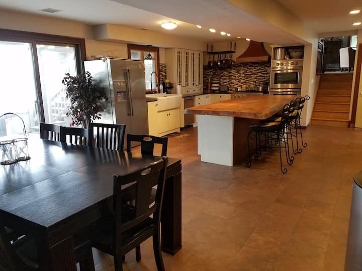 a dining table with chairs and wooden floor