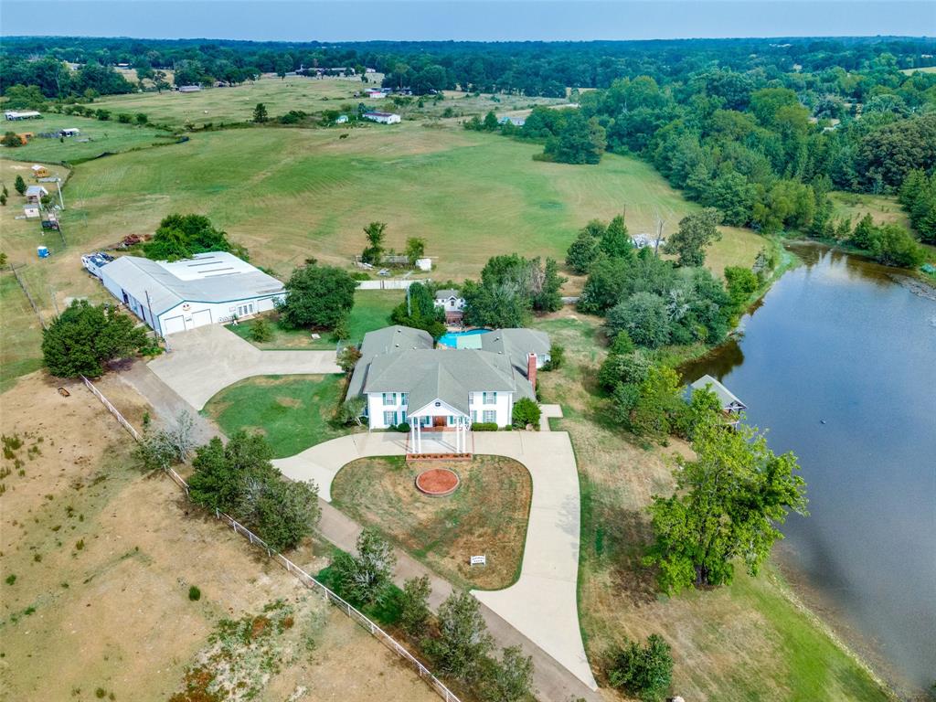 an aerial view of a house with outdoor space