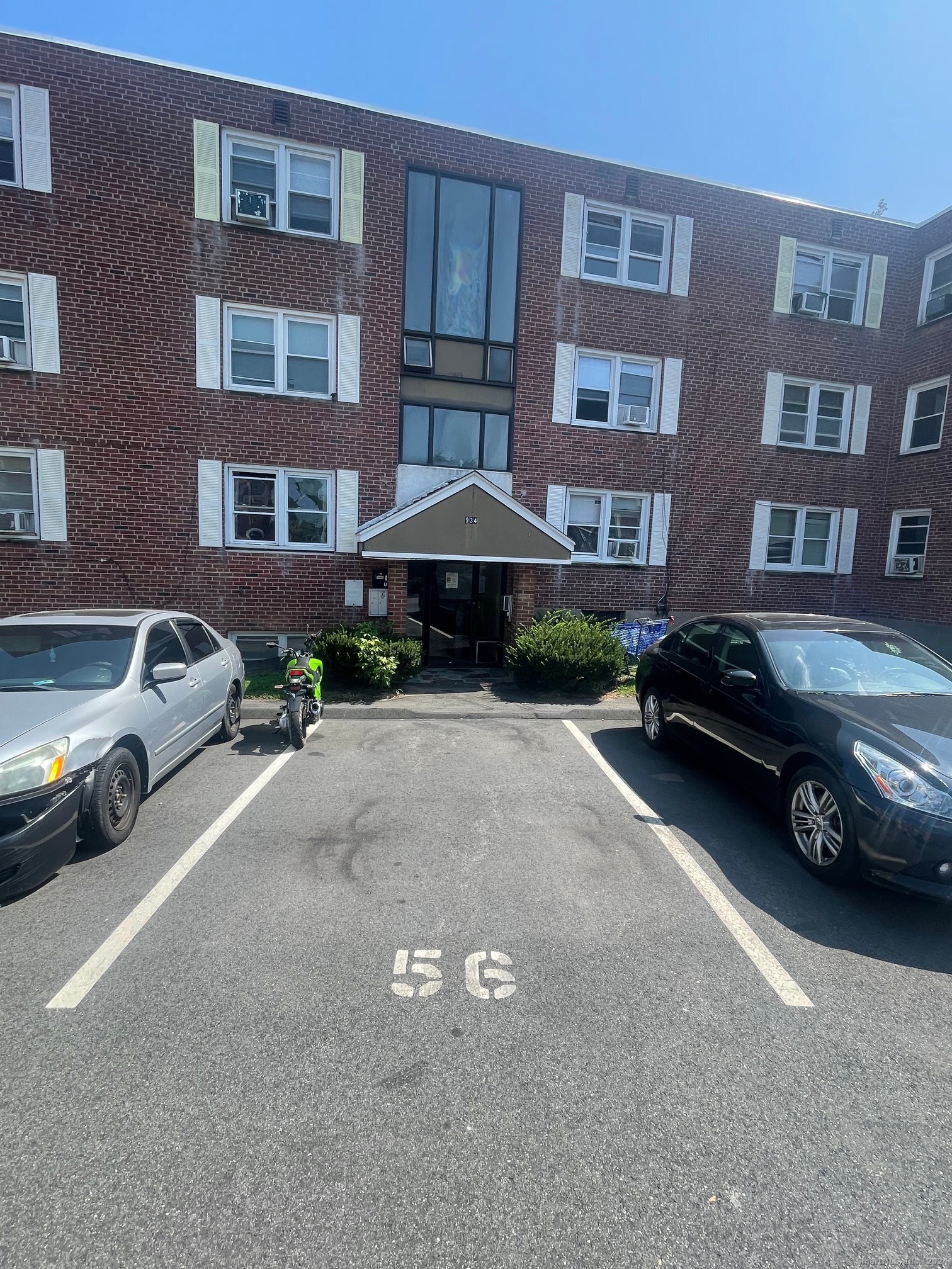 a car parked in front of a brick building