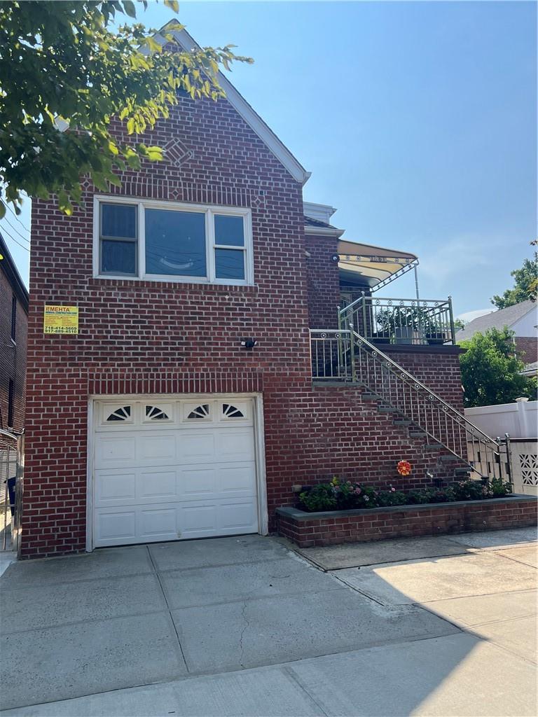 View of side of property featuring a garage