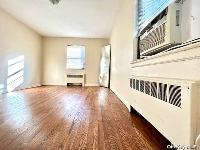 a view of a room with wooden floors and stairs