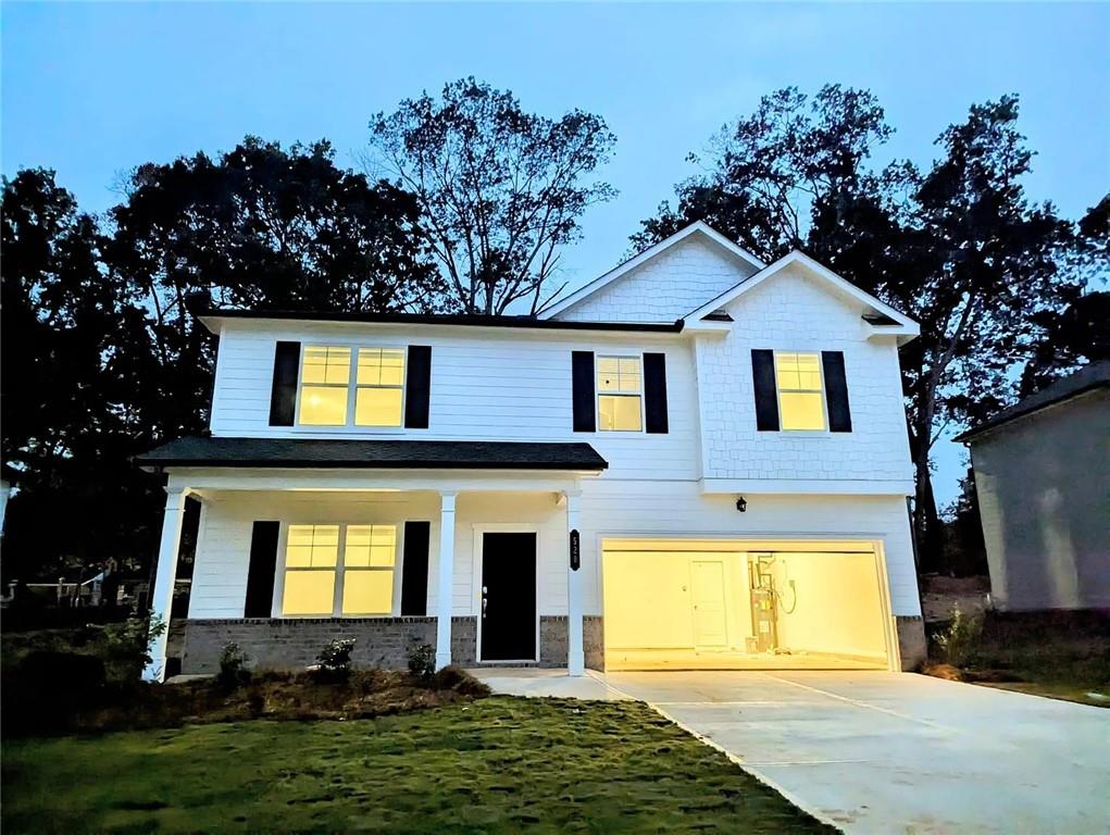 a front view of a house with a yard