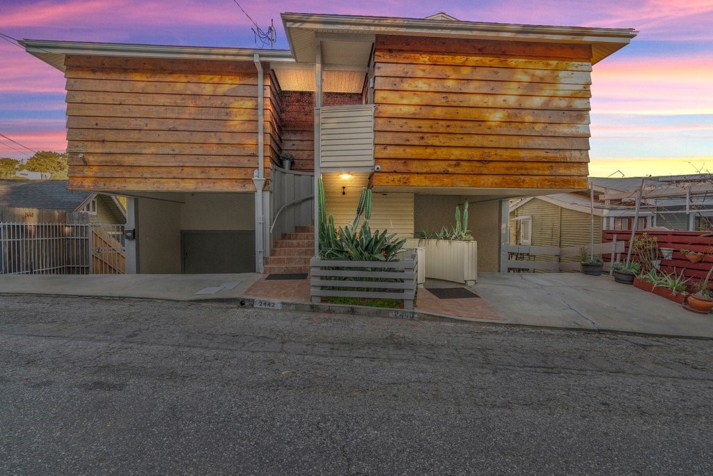 a view of a house with a yard and garage