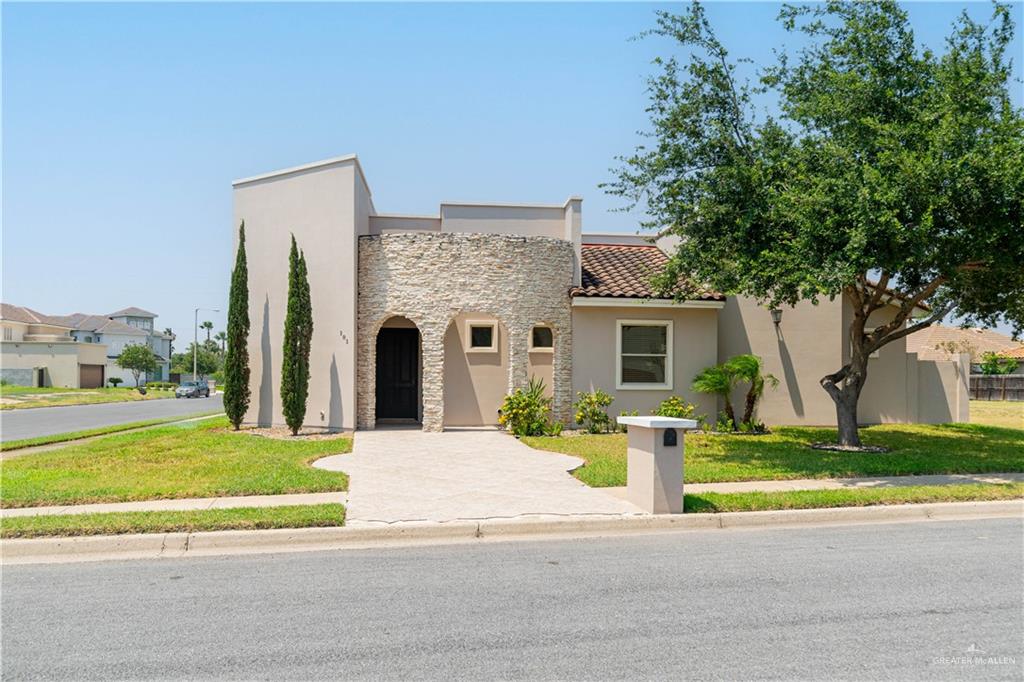 View of front of property with a front lawn