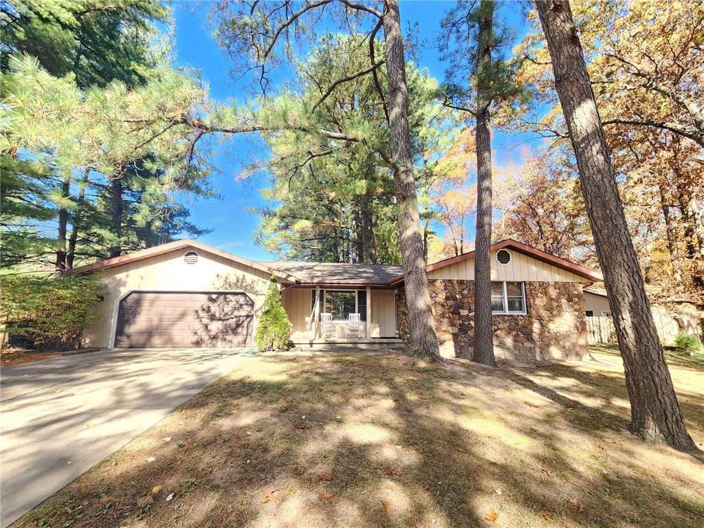 a house with a trees in front of it