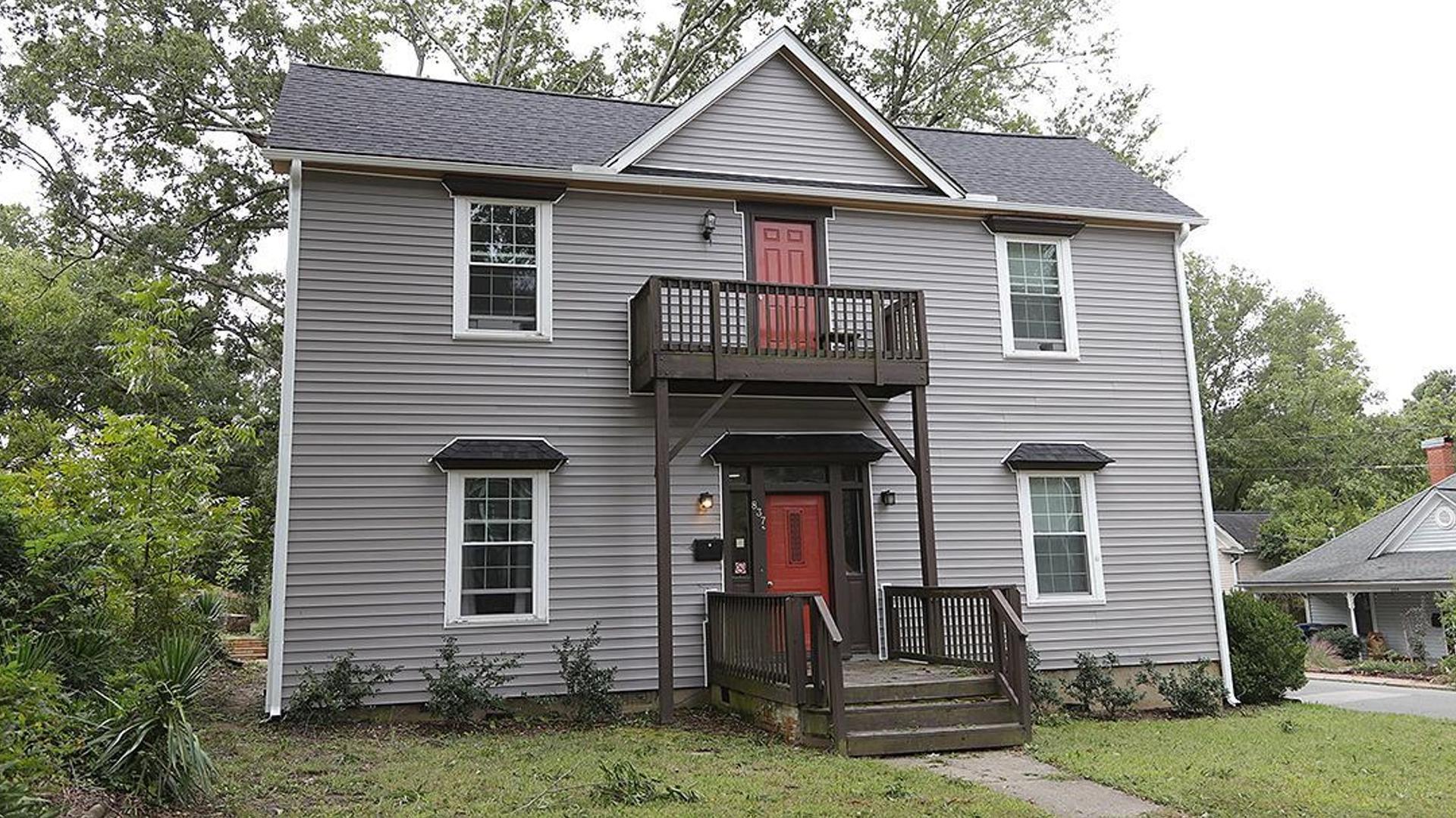 a front view of a house with a yard