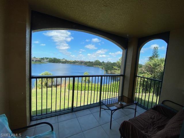 a view of a balcony with furniture