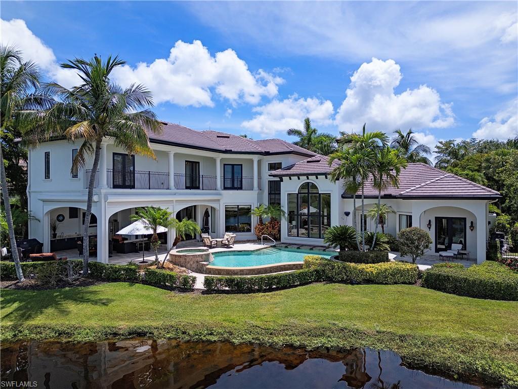 a front view of house with yard and outdoor seating