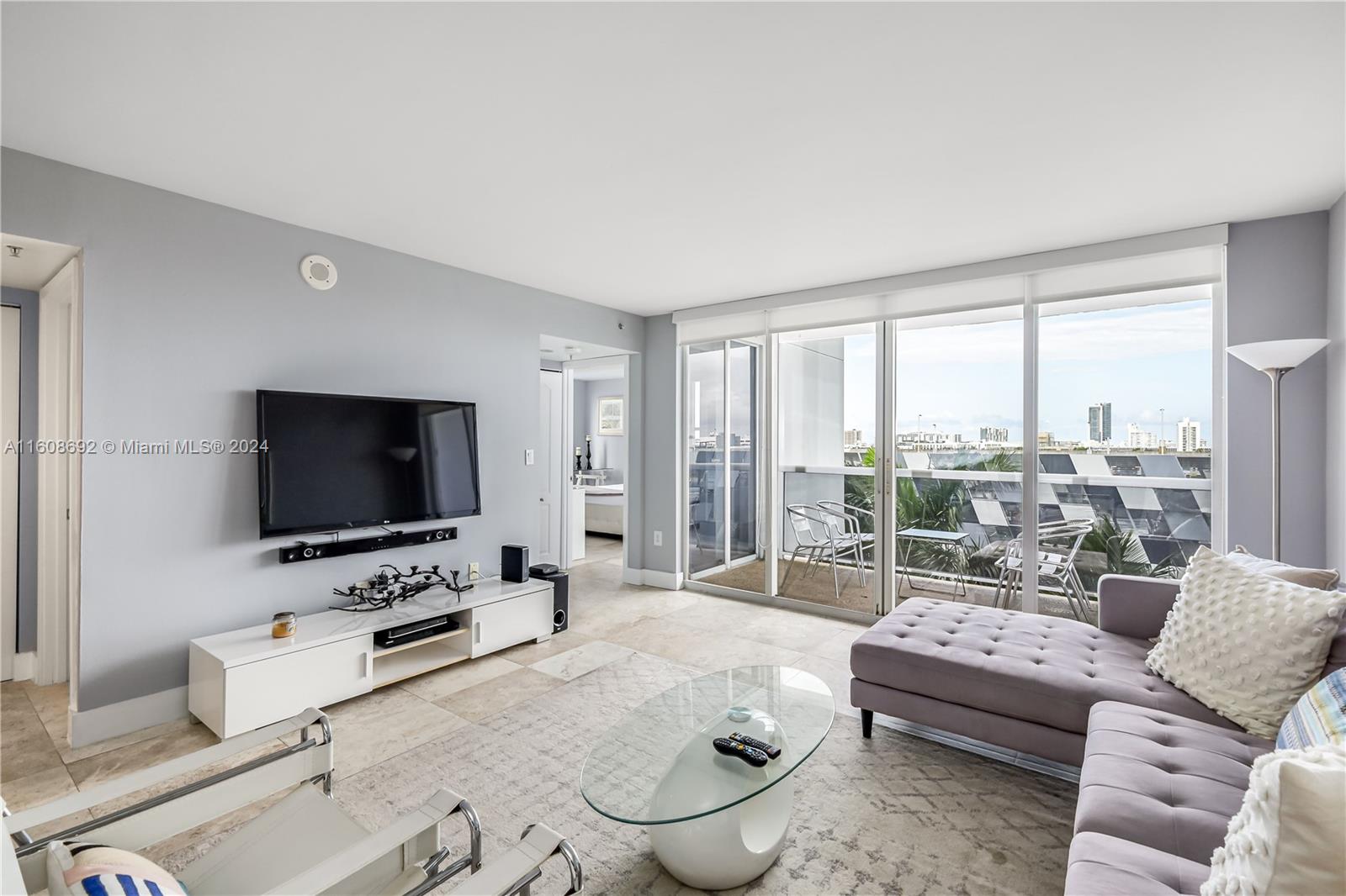 a living room with furniture and a flat screen tv