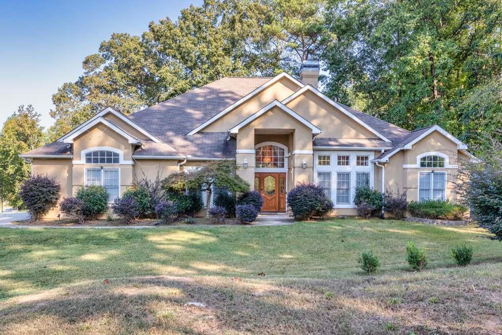 a front view of a house with a yard