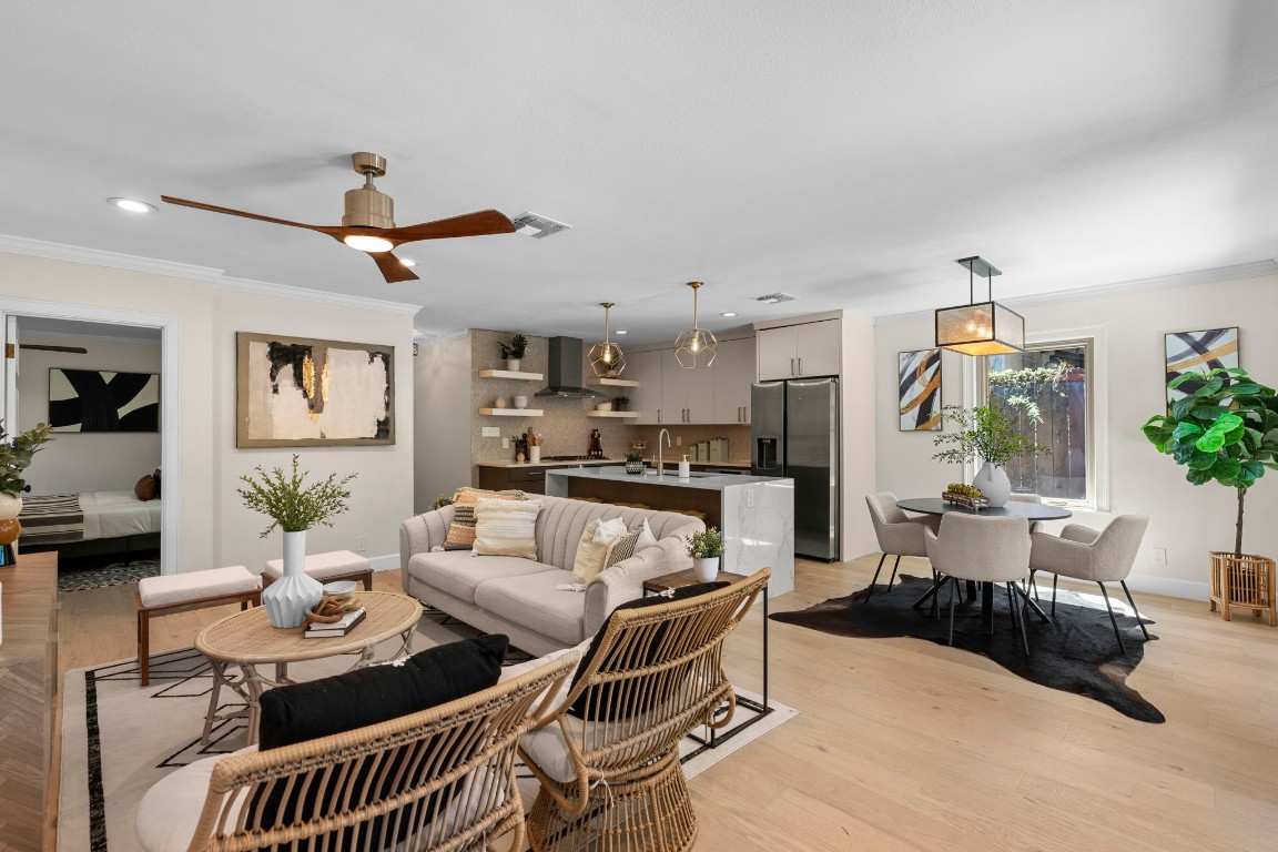 a living room with furniture and kitchen view