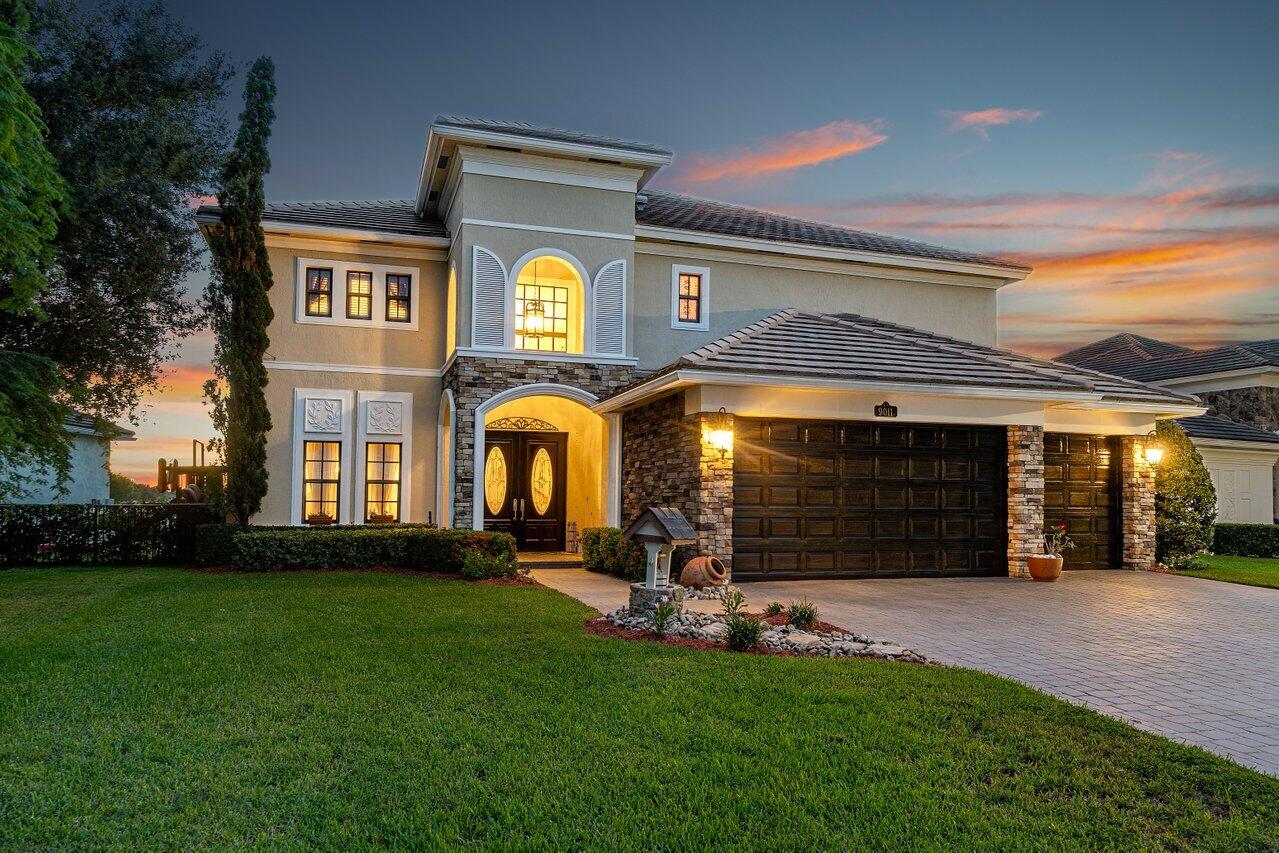 a front view of a house with a yard