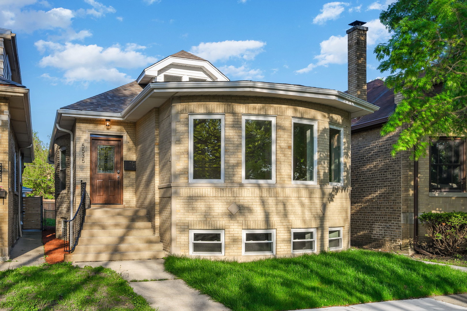 a front view of a house with a yard