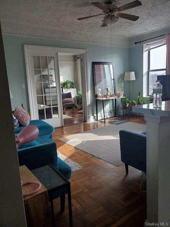 a living room with furniture and a lamp