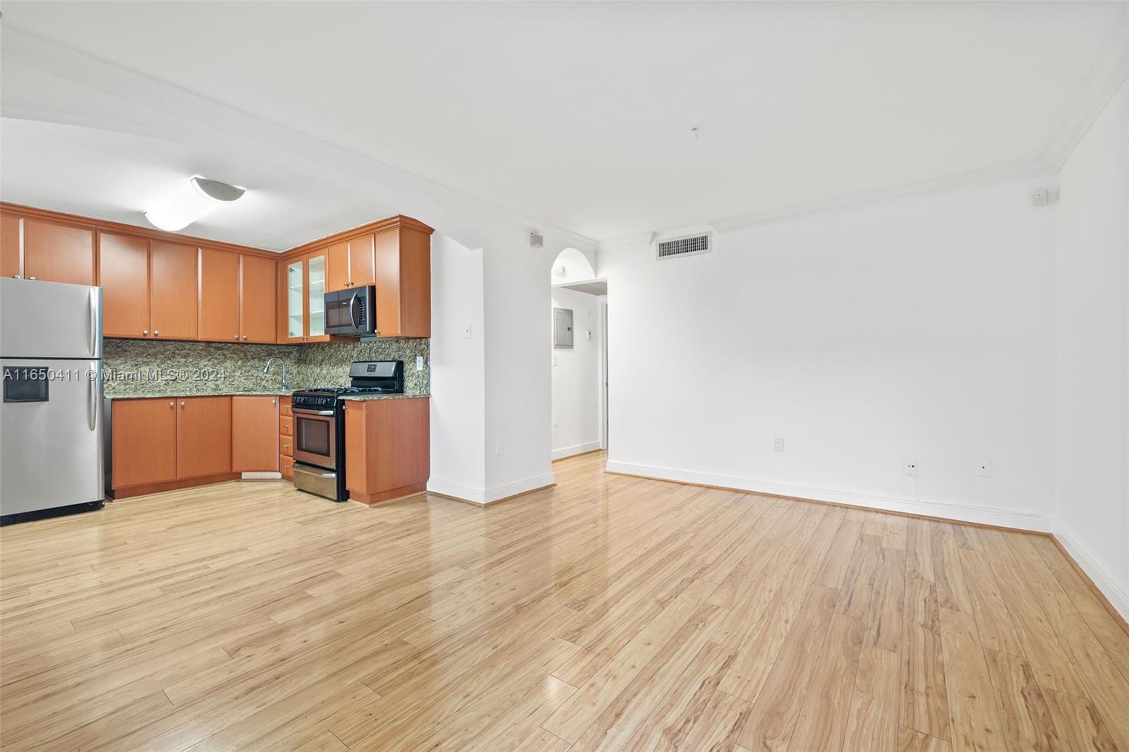 a view of kitchen with wooden floor