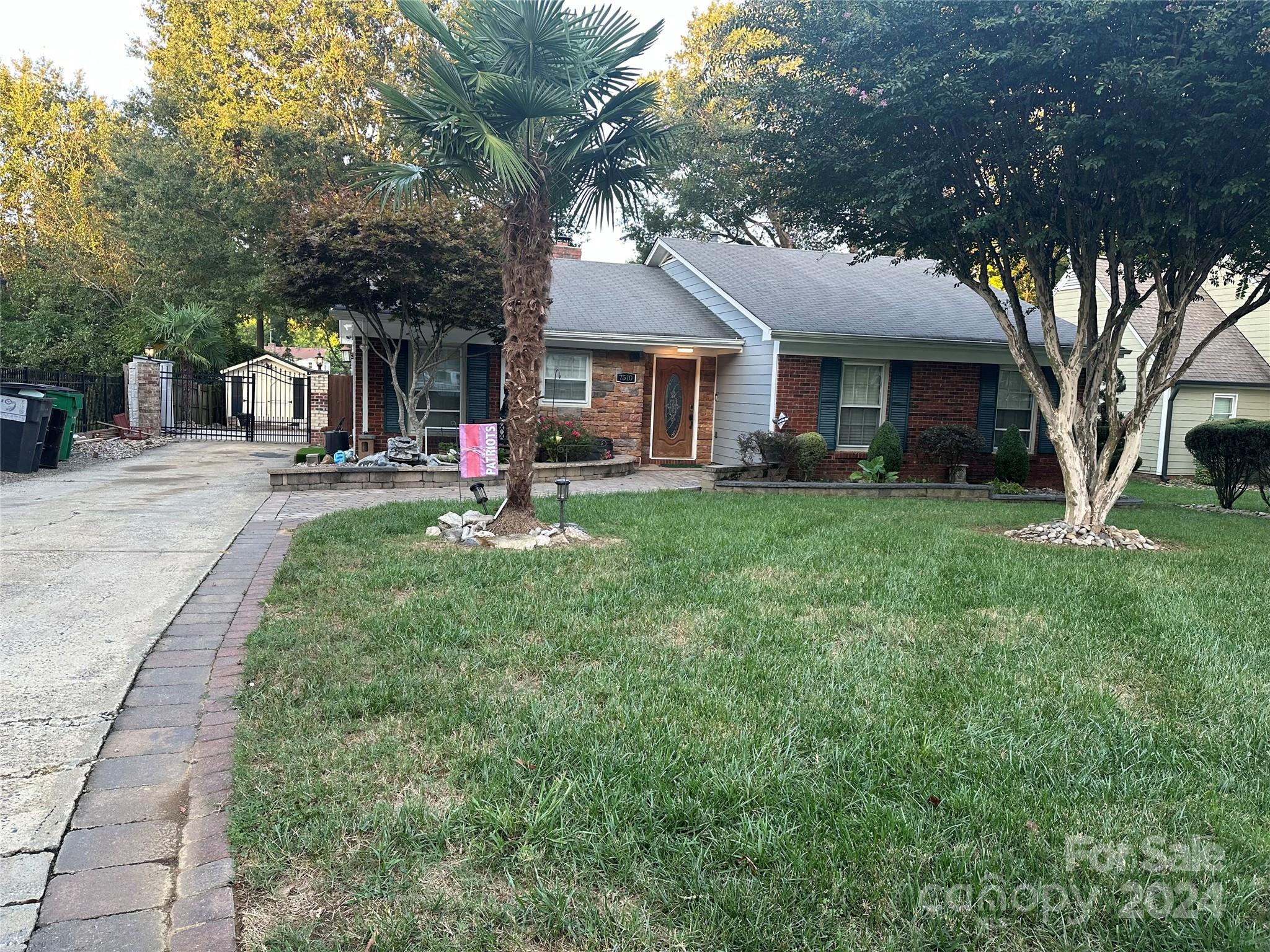 a view of a house with a yard porch and sitting area