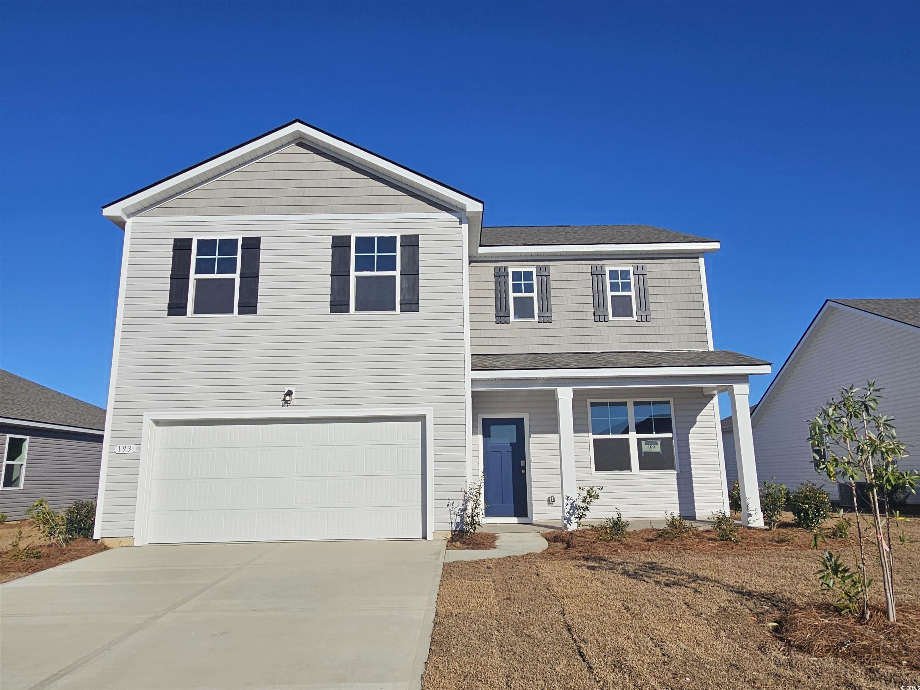 View of property with a garage