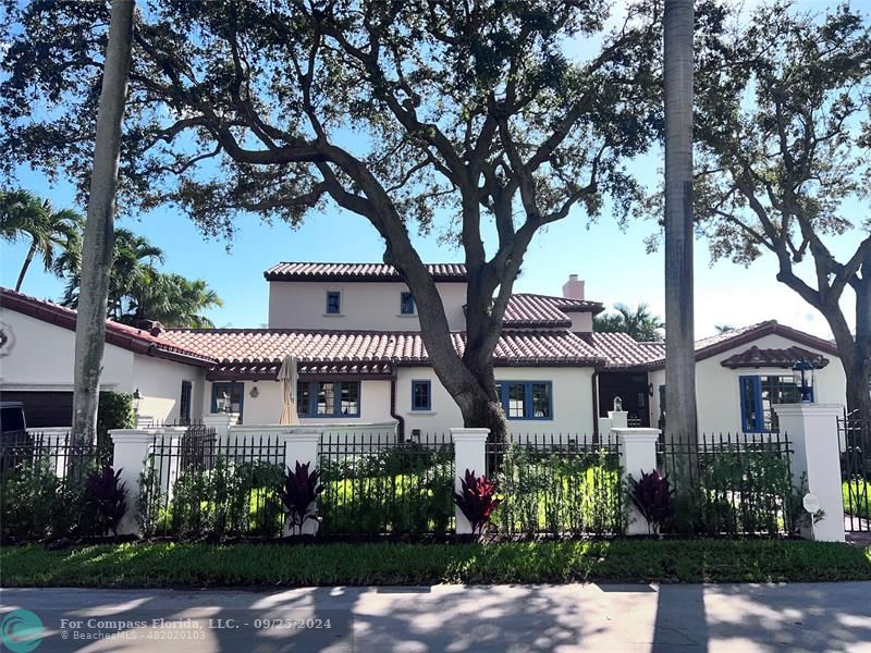 front view of a house with a garden