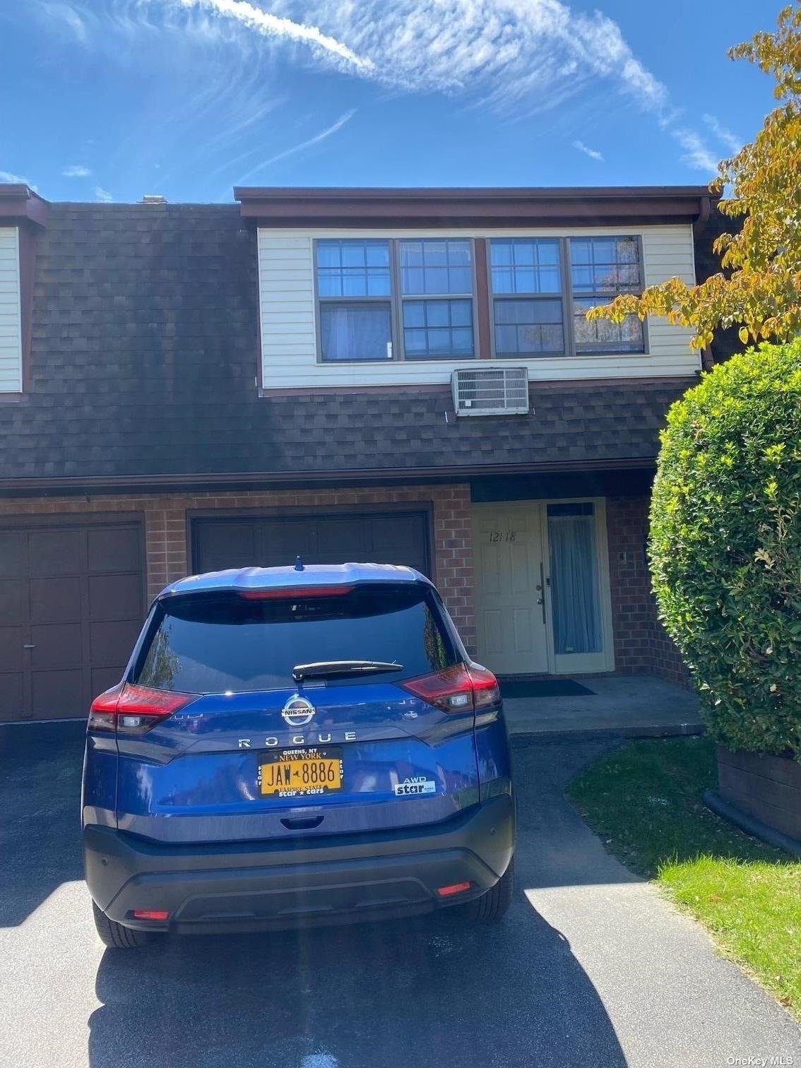 a car parked in front of a house