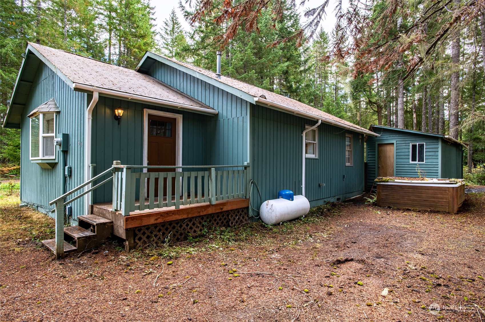 a backyard of a house with wooden fence and deck