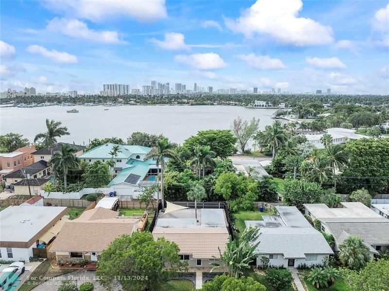 a view of a lake with houses in front of it