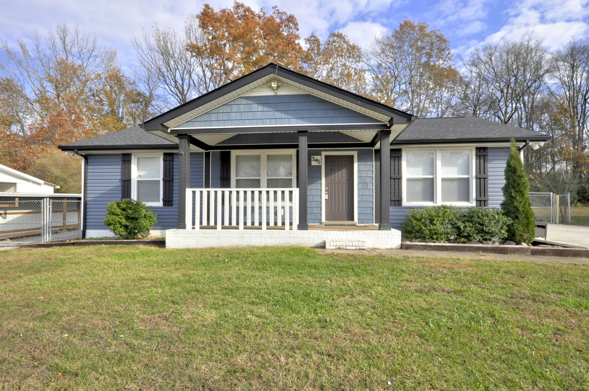 a front view of a house with a yard