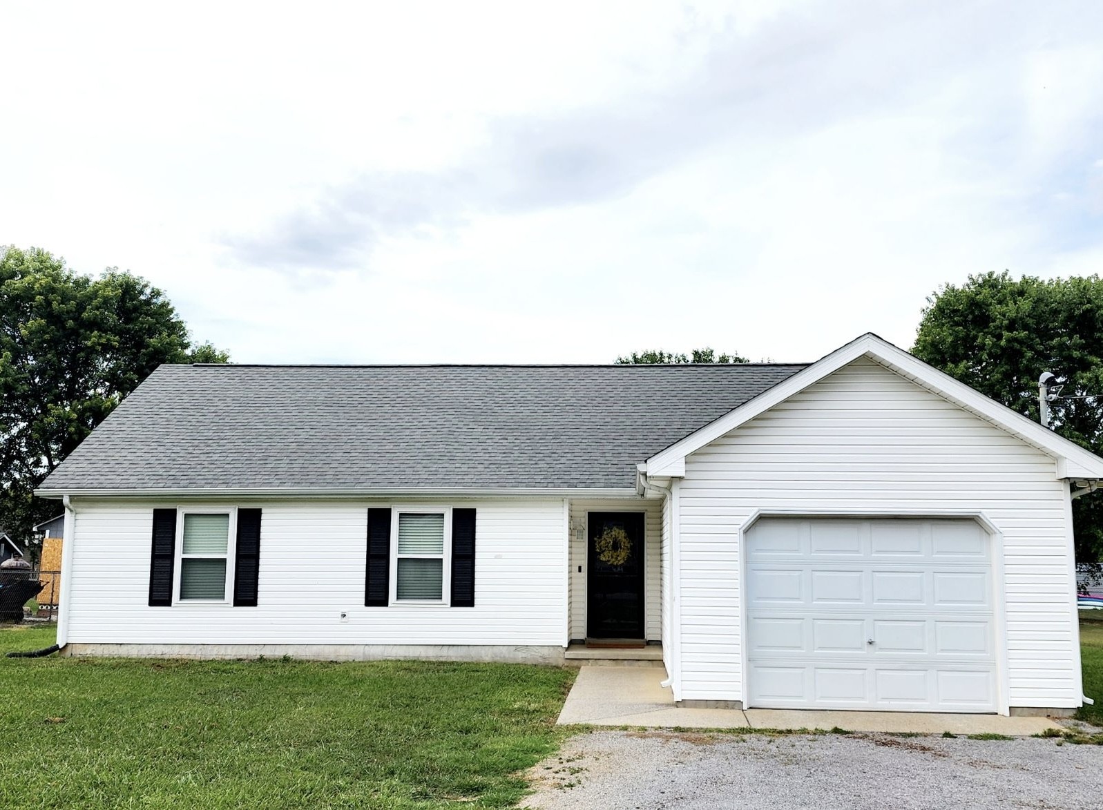 a front view of a house with a yard