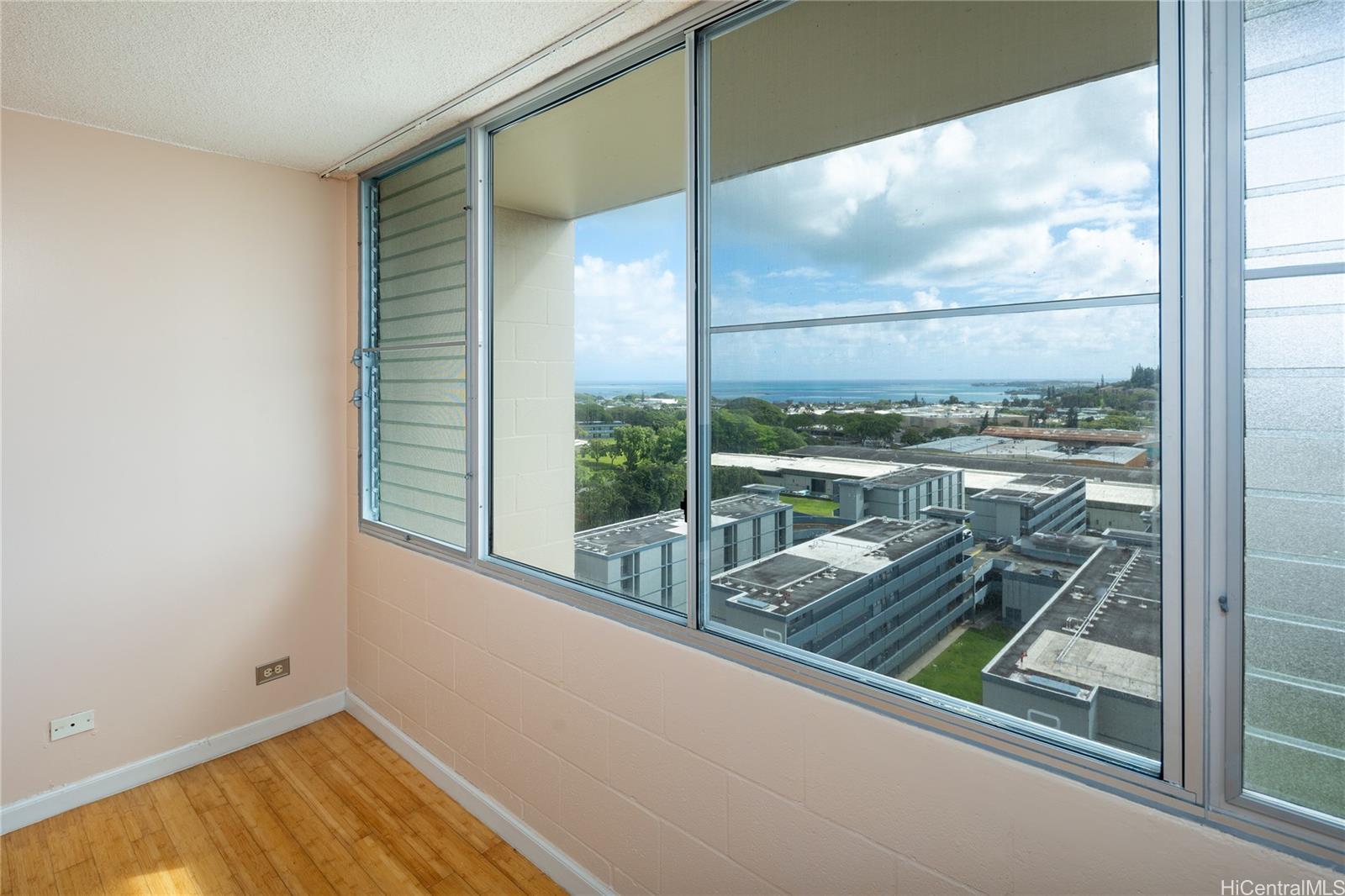 a view of a balcony next to a yard