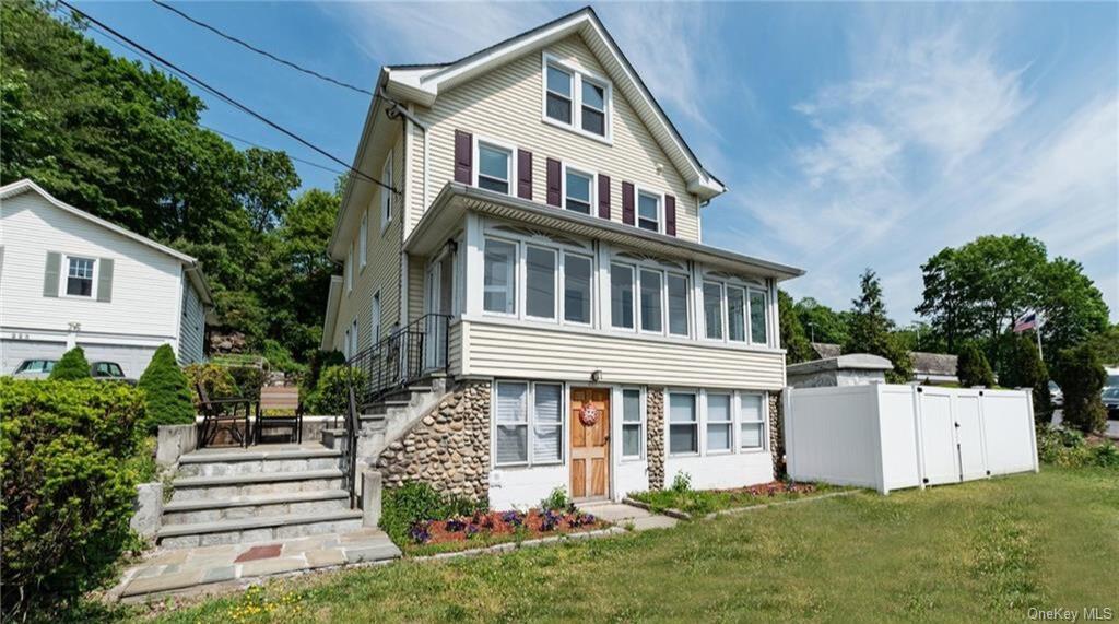 a front view of a house with a yard