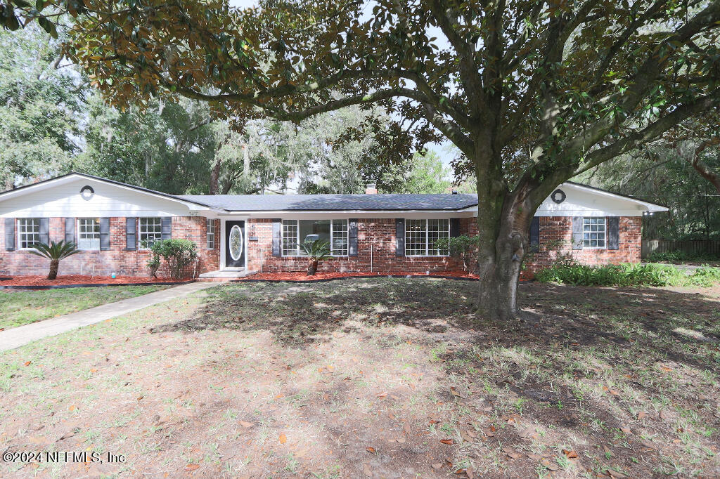 a front view of house with yard porch and green space