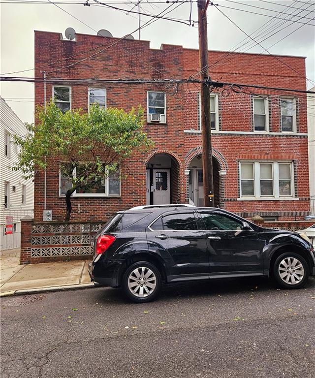 a car parked in front of a house