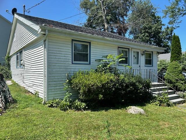 View of front of house with a front lawn