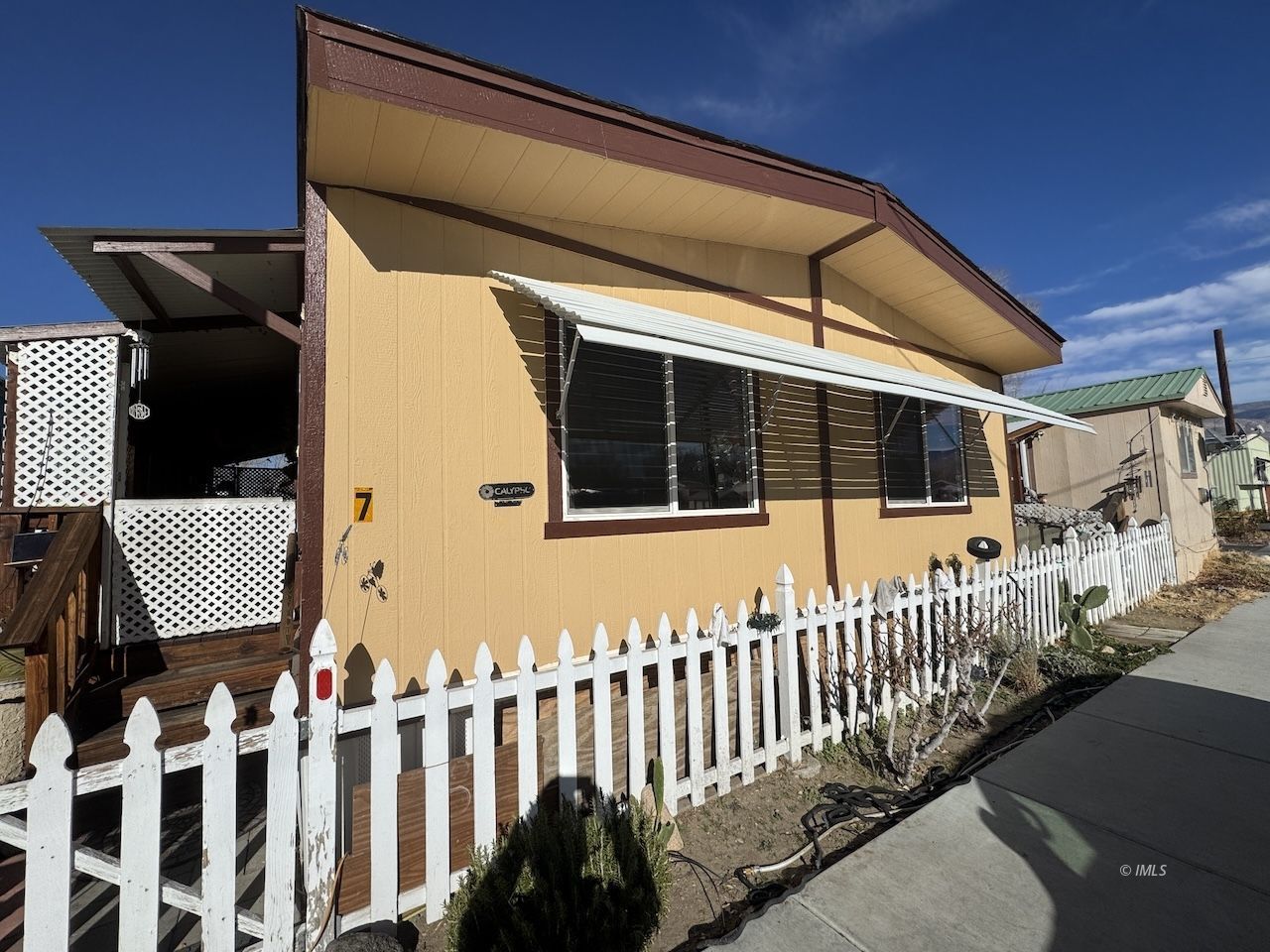 a view of a porch with wooden fence