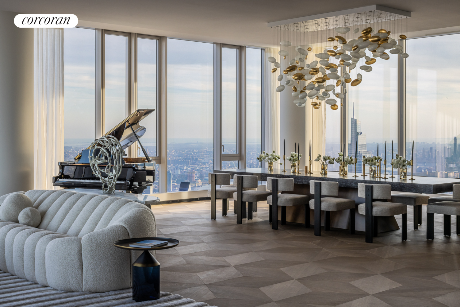 a living room with furniture a large window and a chandelier