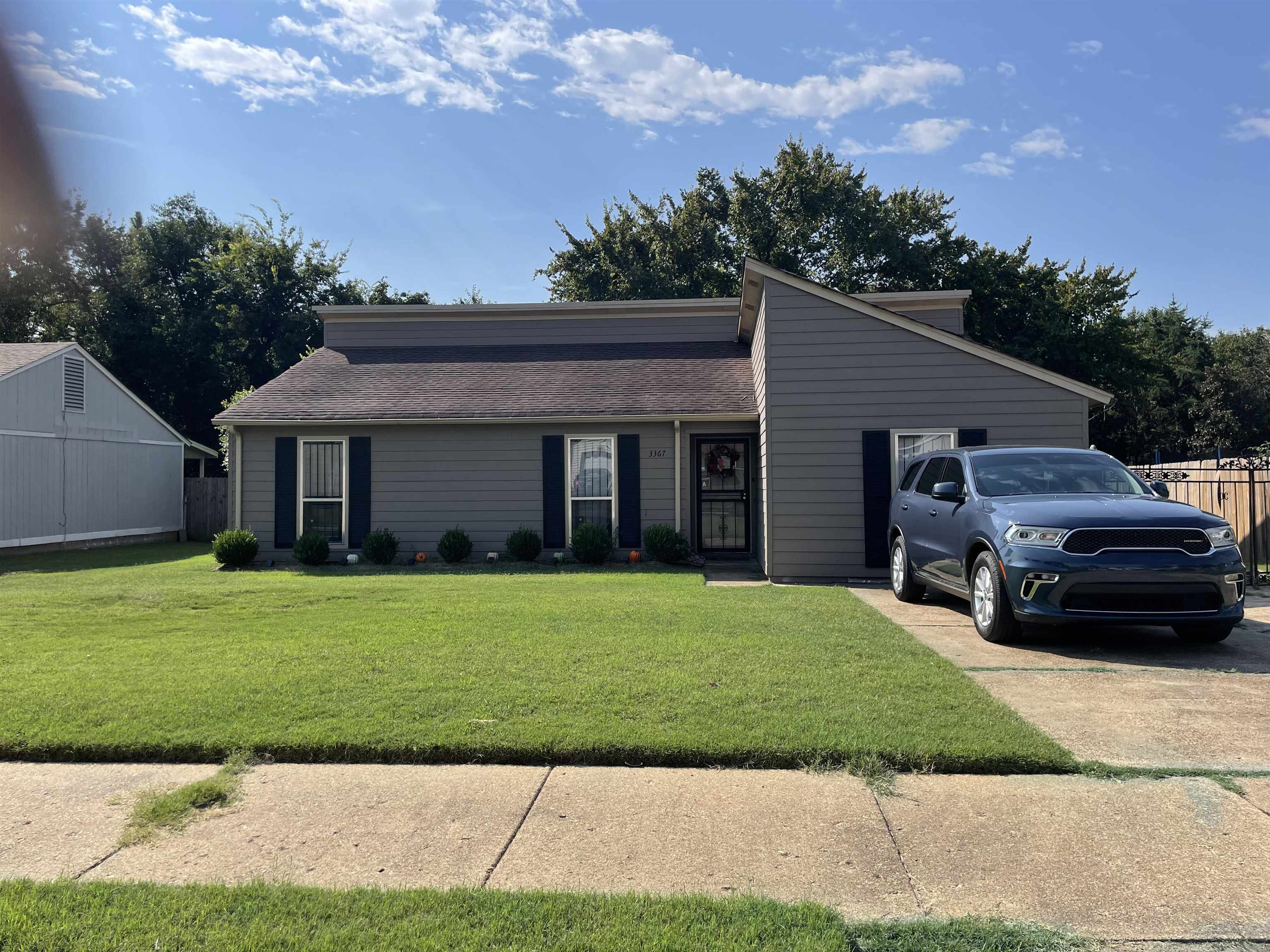 Ranch-style home with a front yard