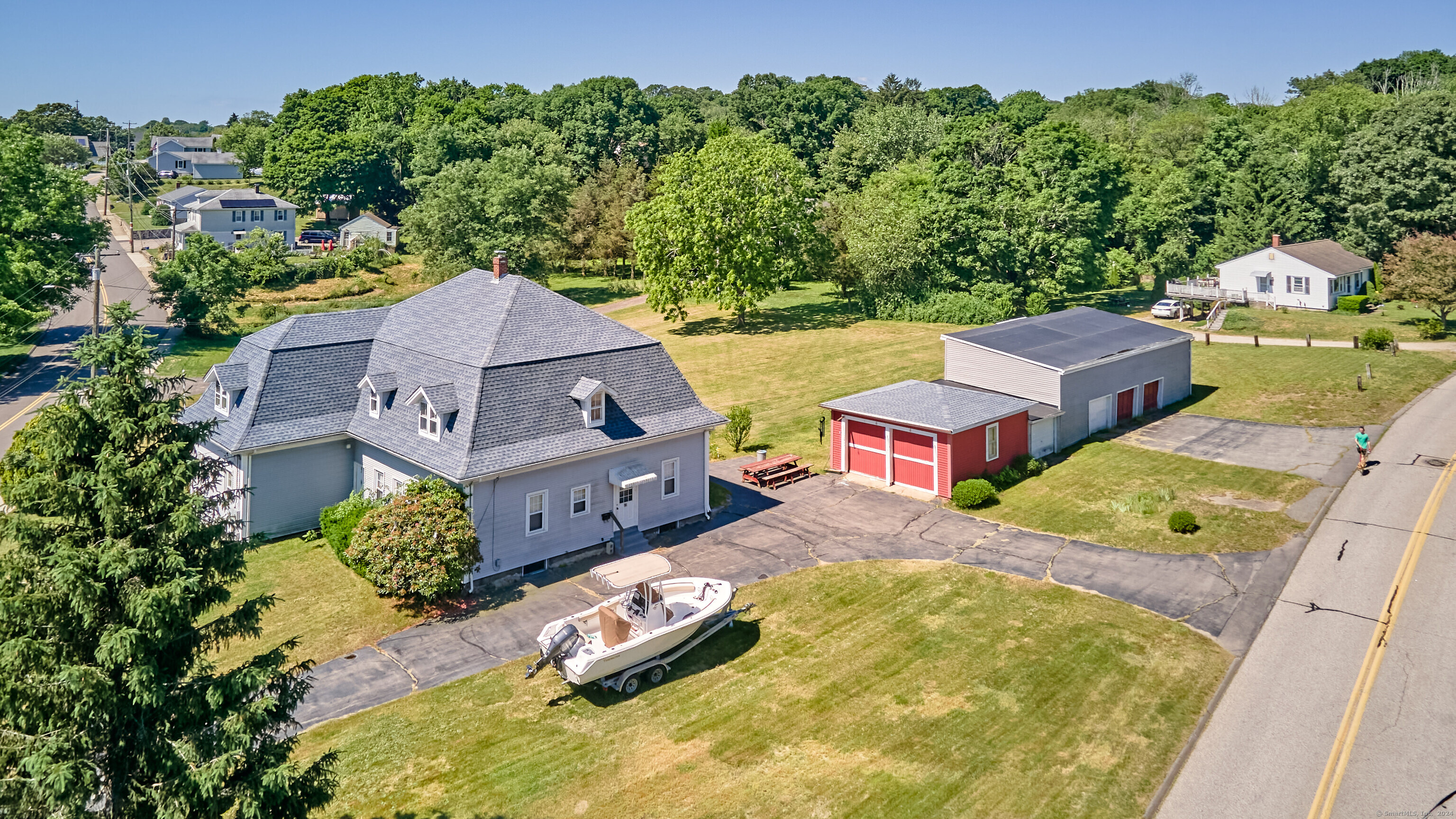 an aerial view of residential houses with outdoor space