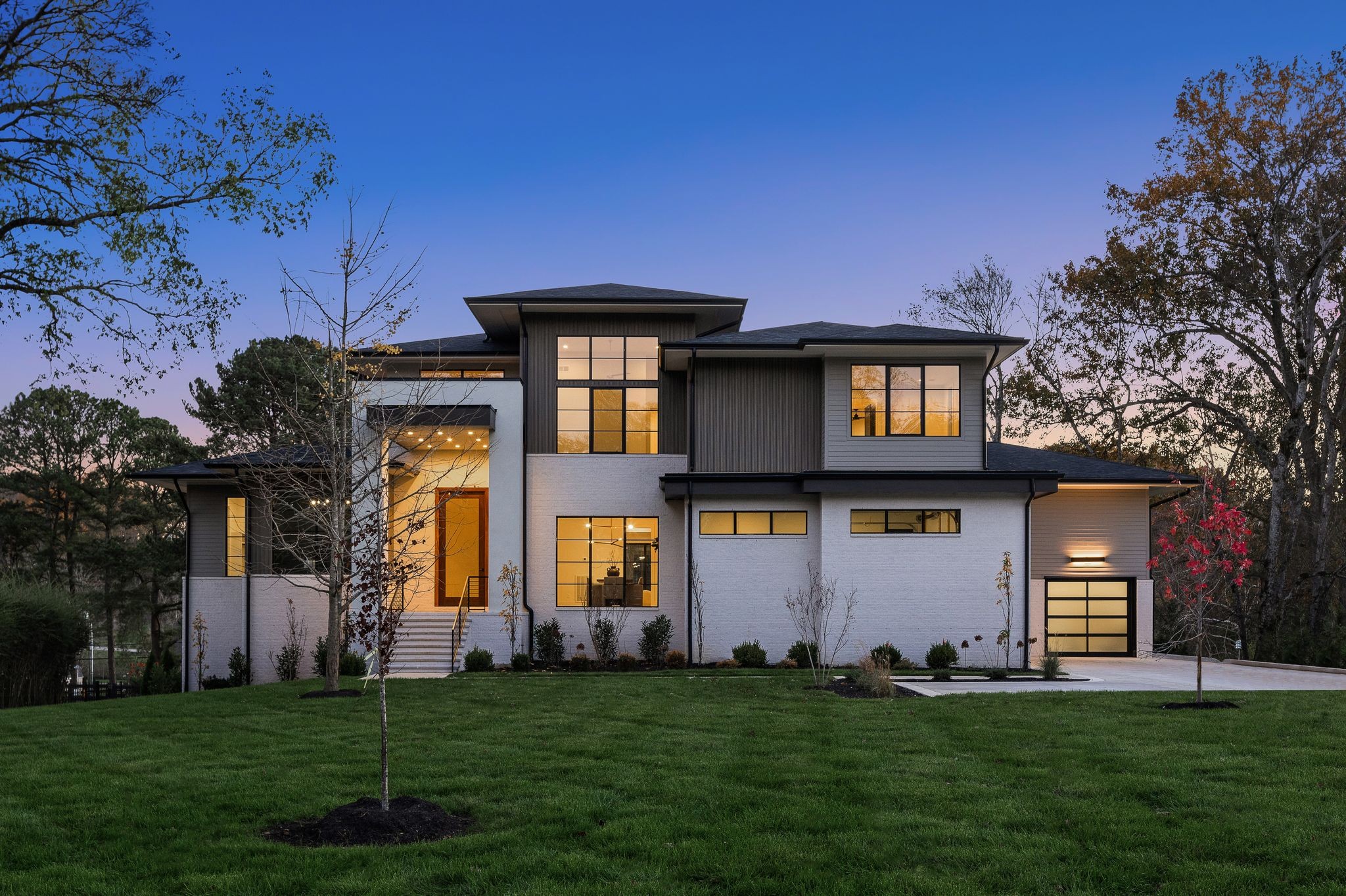 A striking modern silhouette, this home’s exterior showcases clean lines and a bold architectural presence. Located in the coveted West Meade neighborhood of Nashville, nestled between Belle Meade and West Nashville, daily conveniences abound.