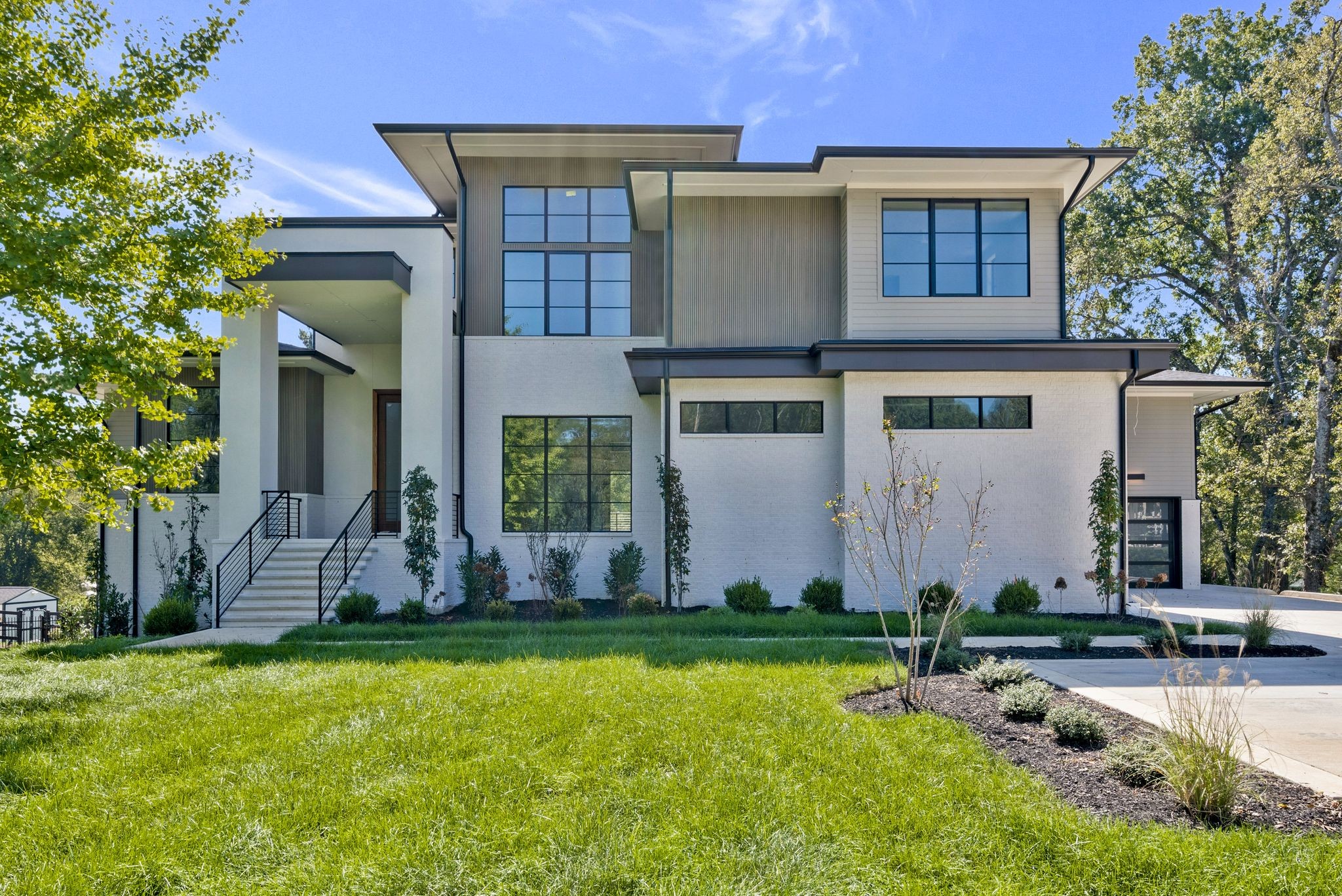 a front view of a house with garden