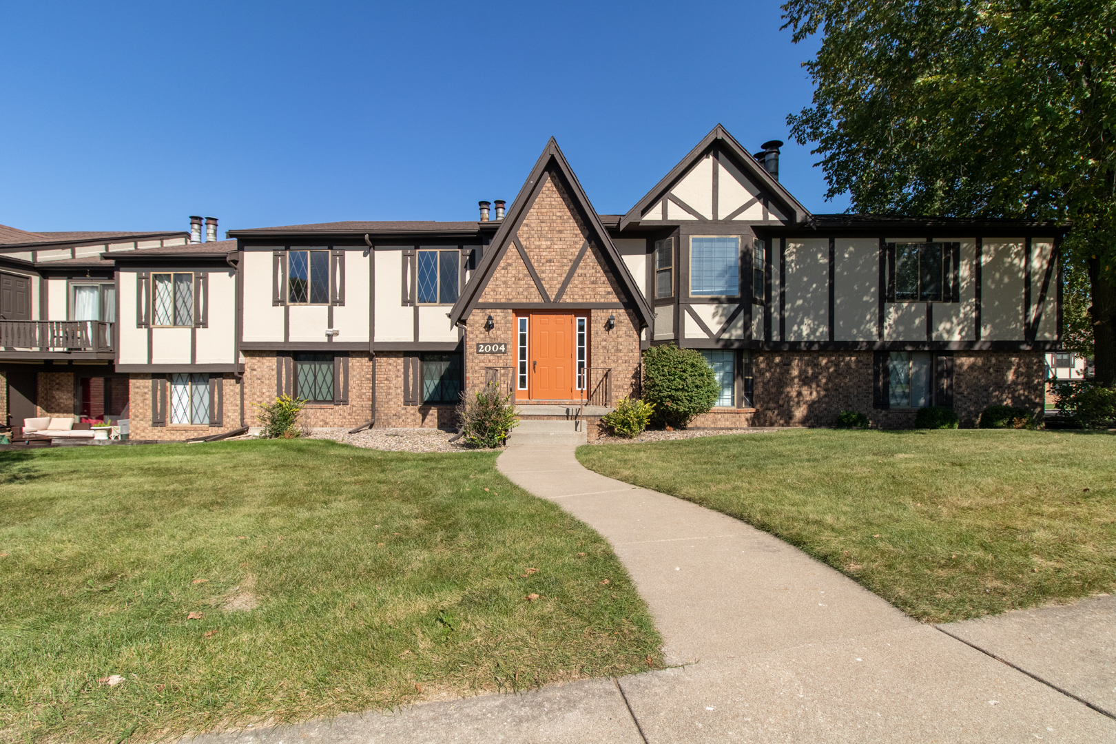 front view of a house with a yard