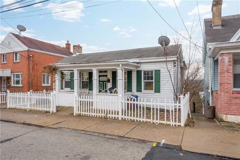 a front view of a house with a porch