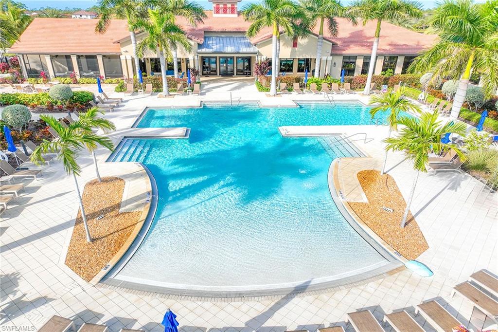 a view of a swimming pool with a lounge chairs