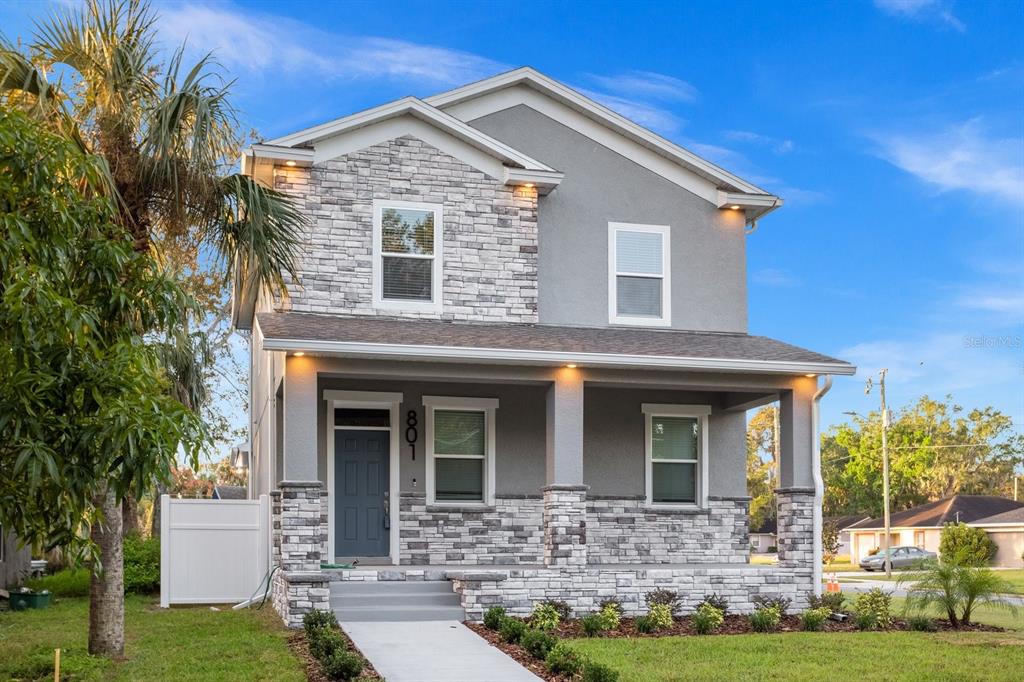 front view of a house with a yard