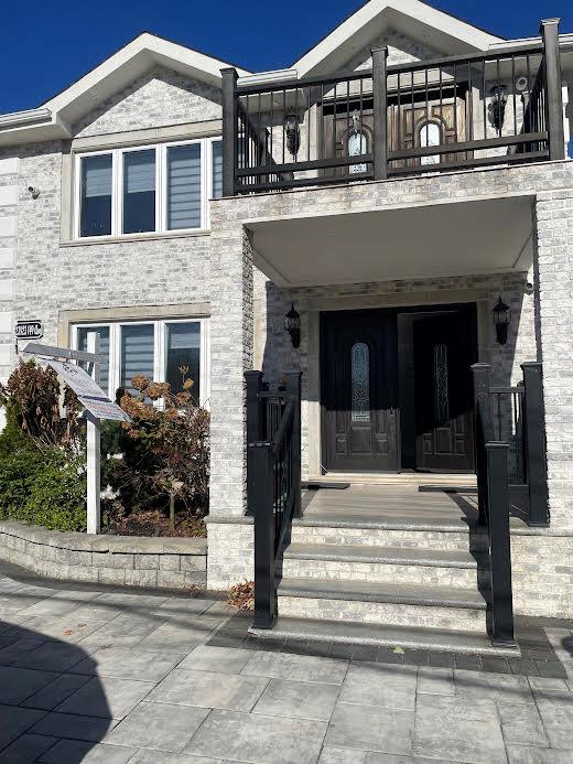 View of front of home featuring a balcony