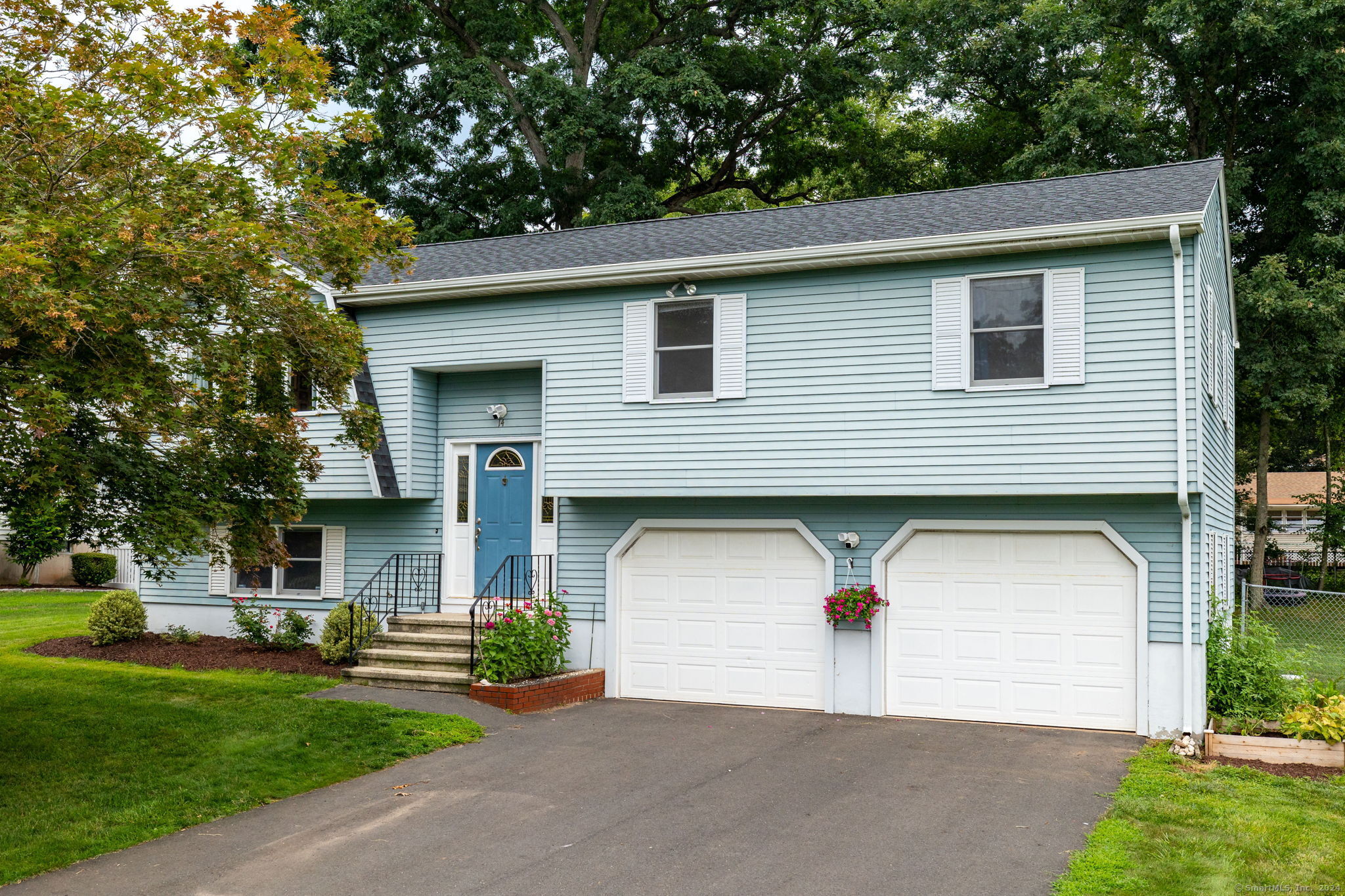 a front view of a house with garage