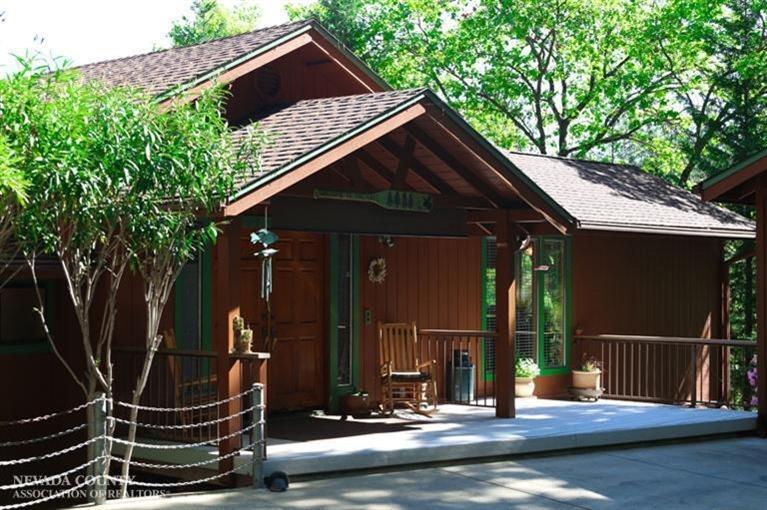 a backyard of a house with barbeque oven